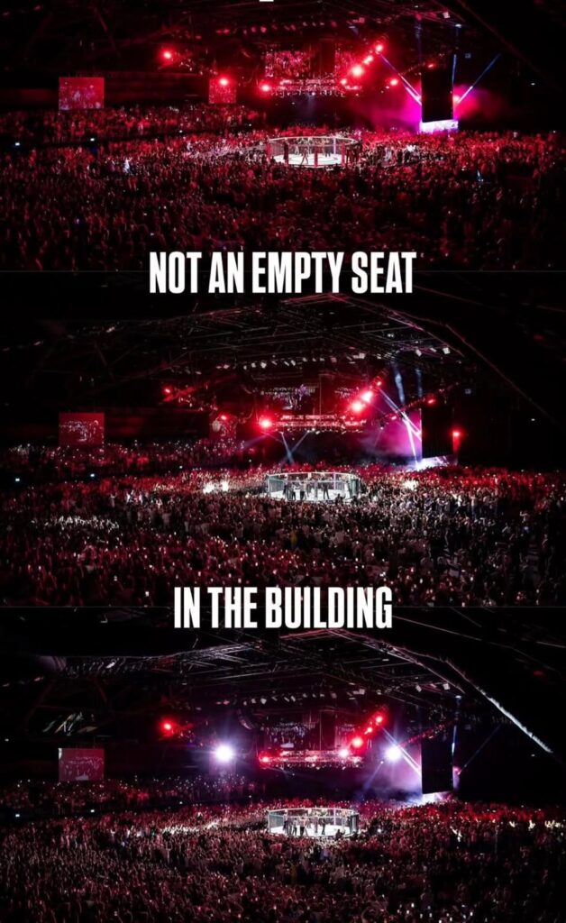 Packed arena crowd around a fight cage, captioned 'Not an empty seat in the building'